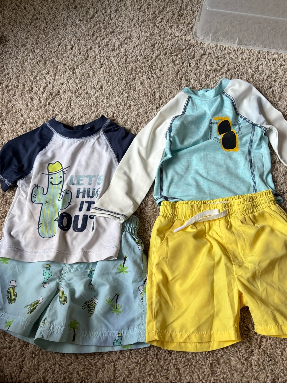 Two Swim Trunks and Rash Guards